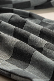 Checkerboard denim wide leg trousers in dark gray with a textured weave.