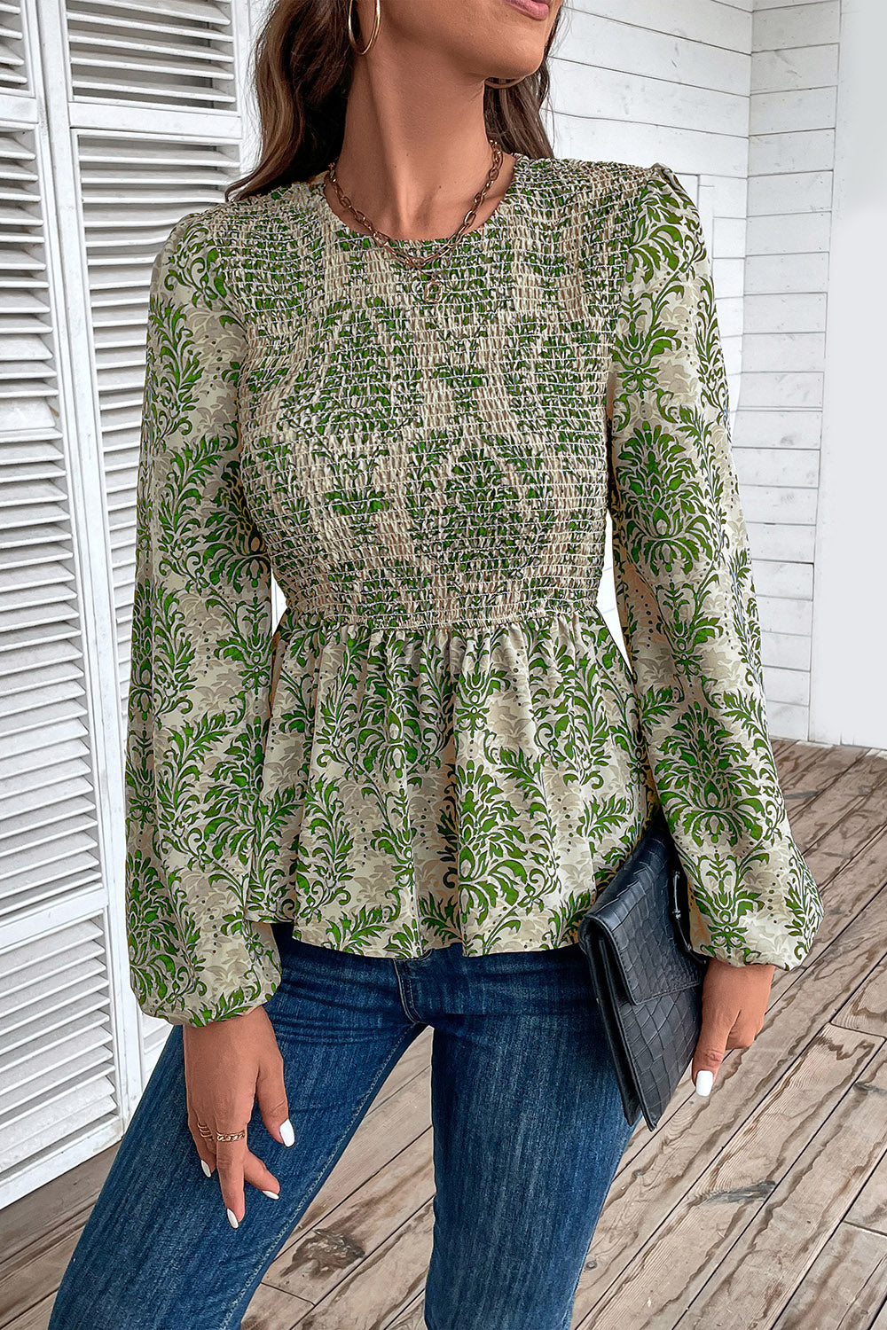 Green damask print peplum blouse with smocked bodice and puff sleeves.