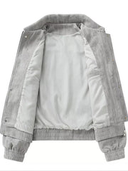 Grey corduroy trucker jacket with white lining and elastic cuffs and hem.