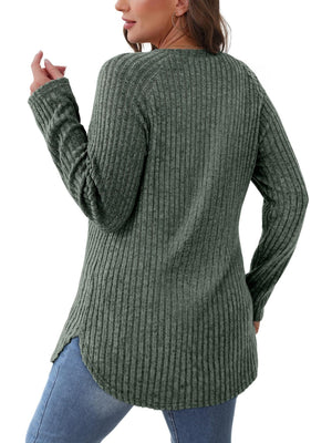 Moss ribbed knit sweater with raglan sleeves and asymmetric hem detail.