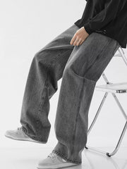 Relaxed wide-leg jeans in dark gray denim with drawstring waist and casual styling.