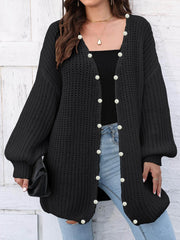 Black balloon sleeve cardigan with pearl buttons and open front.