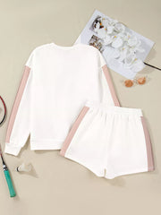 White cotton color block pullover and shorts set with blush pink side stripes.