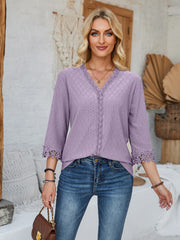 Lavender eyelet trimmed V-neck blouse with 3/4 sleeves and lace cuffs.