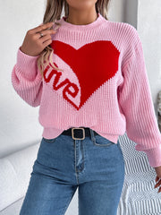 Pink knit sweater with a red heart and "love" graphic, crew neck, long sleeves.