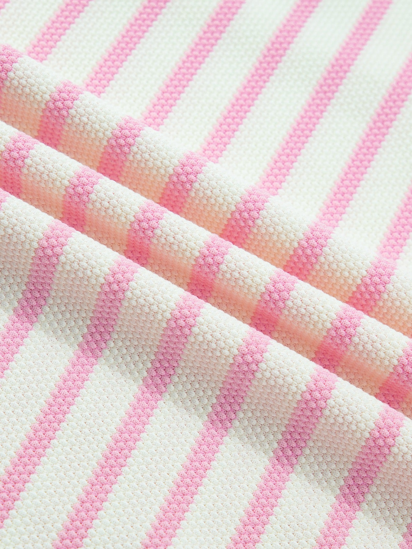 Ruffled short-sleeve blouse in pink and white stripes, cotton knit fabric.