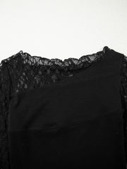 Black asymmetric sheer blouse with lace trim and long sleeves.