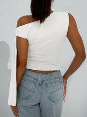 White asymmetrical tie detail cropped blouse with one sleeve and one sleeveless side.