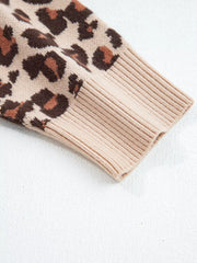 Leopard print ribbed sweater dress sleeve with beige knit cuff detail.