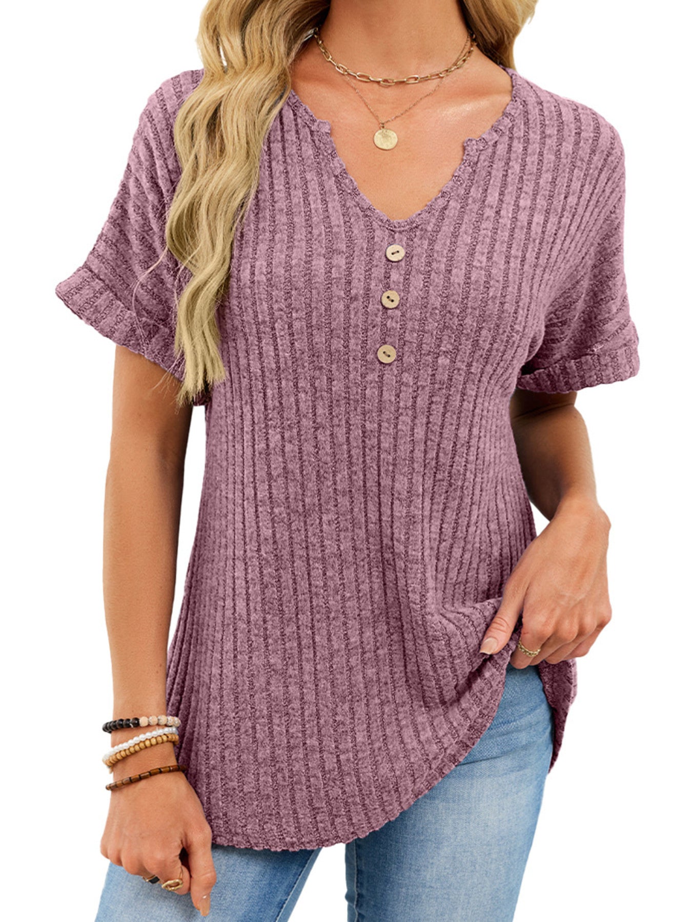 Ribbed knit short sleeve t-shirt in dusty blue with decorative buttons and a curved hem.