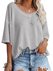 Grey waffle knit relaxed v-neck t-shirt with short sleeves.