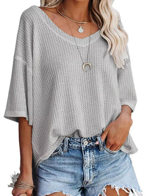 Grey waffle knit relaxed v-neck t-shirt with short sleeves.