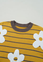 Yellow knit sweater with grey stripes and white intarsia daisies.