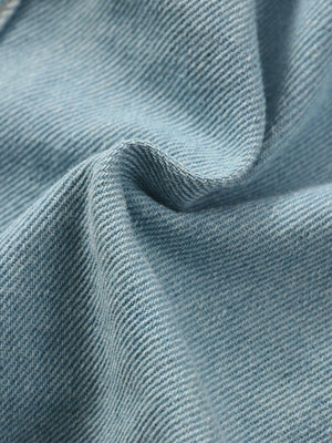 Light blue distressed denim skirt fabric detail