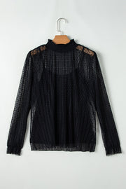 Black sheer mock neck blouse with textured dots and vertical pleats.