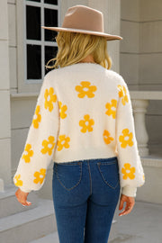 Cream fuzzy cropped cardigan with yellow floral print and balloon sleeves.