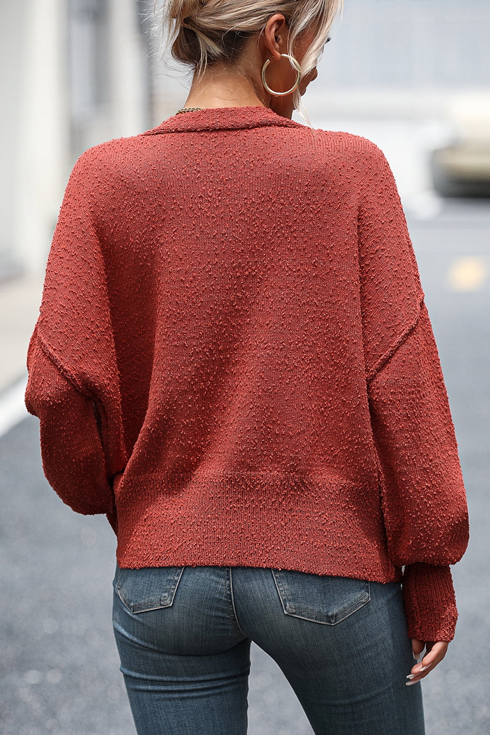 Textured bouclé button-down cardigan in rust with a relaxed fit and dropped shoulders.