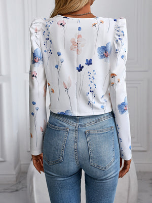 White floral print jacket with puff sleeves and a cropped length.