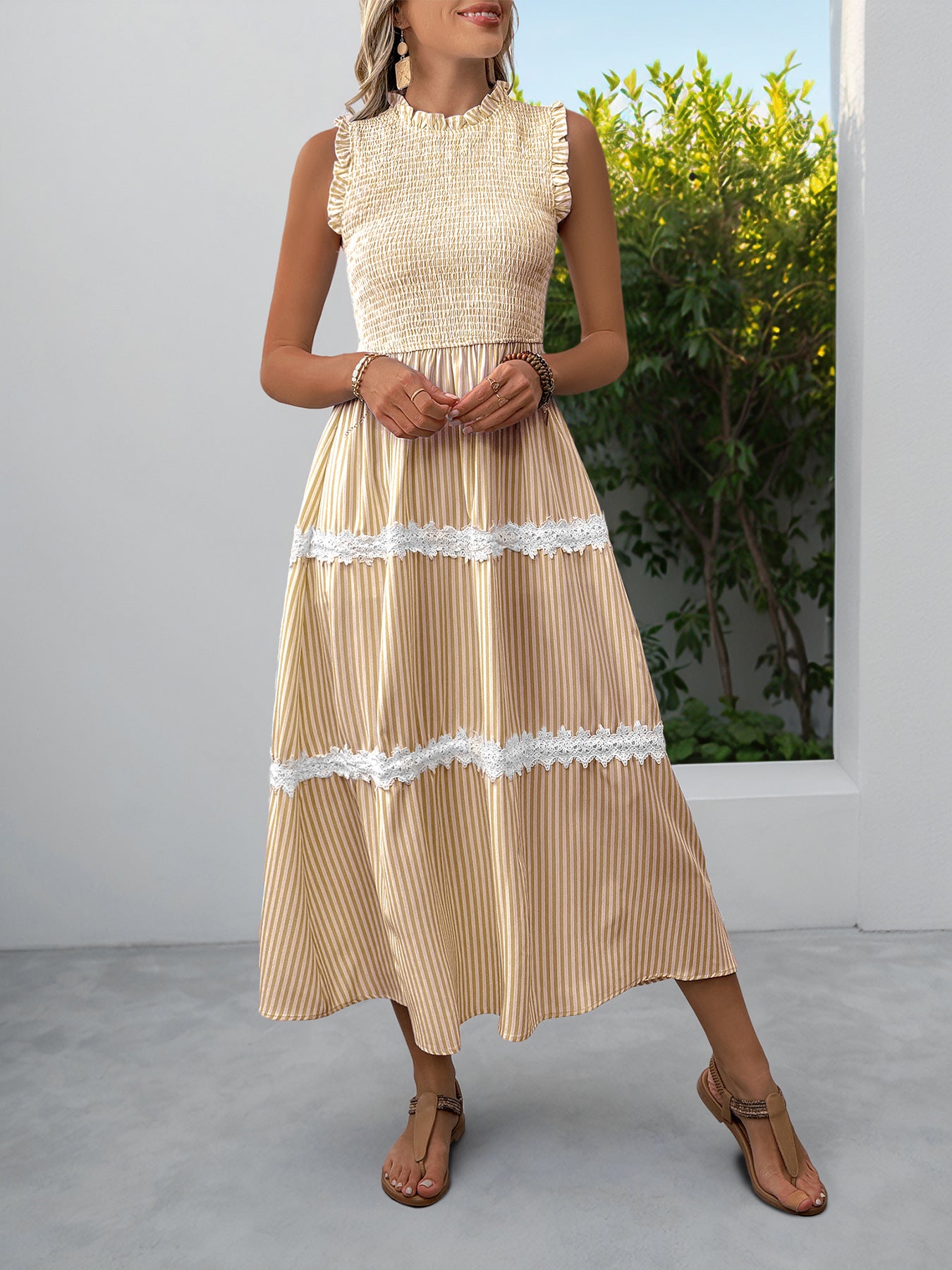 Yellow striped midi dress with smocked bodice and lace trim tiers.
