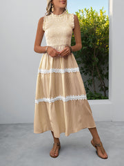 Yellow striped midi dress with smocked bodice and lace trim tiers.