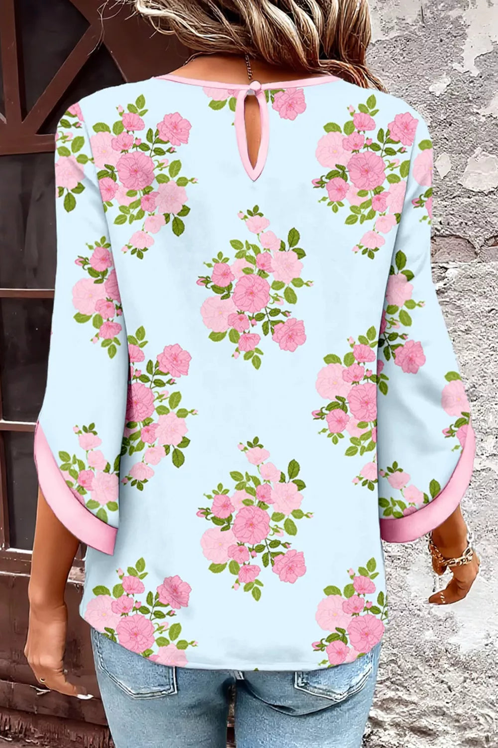 Light blue cotton shirt with pink floral print, 3/4 sleeves, and pink trim.
