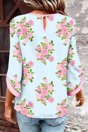 Light blue cotton shirt with pink floral print, 3/4 sleeves, and pink trim.