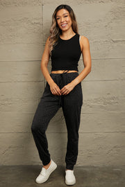 Shadow Leopard Relaxed-Fit Drawstring Trousers in Charcoal with a subtle leopard print.