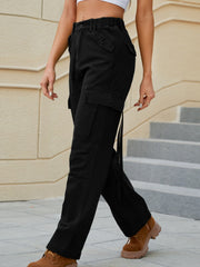 Black utility pocket straight leg cargo pants with tie detail and elastic waist.