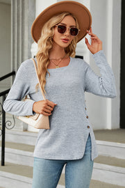 Light blue asymmetric top with square neck and button detail on the side.