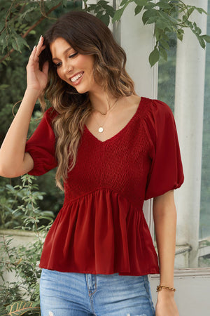 Deep Red smocked bodice peplum top with v-neck and puff sleeves