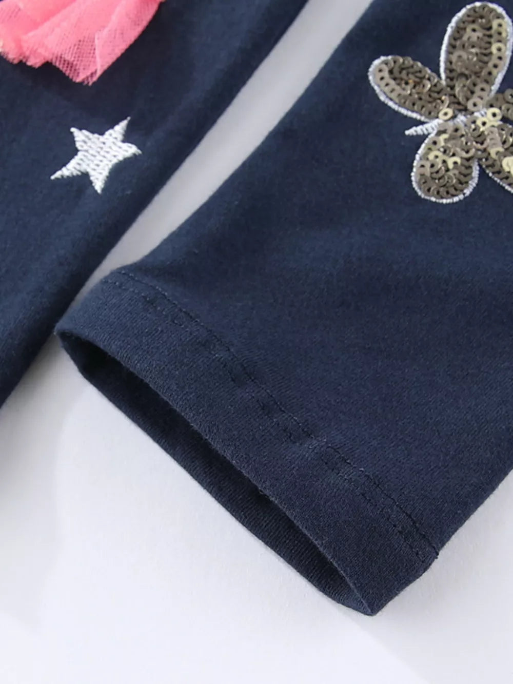Dark navy cotton leggings with embroidered star and sequin butterfly details.