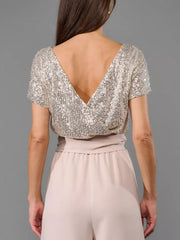 Sequin bodice with V-neck and palazzo pants in dusty pink.