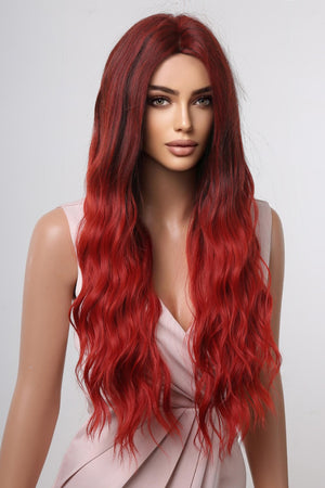 Crimson ombre synthetic wave wig with dark roots and long, wavy red hair.