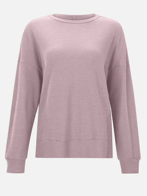 Dusty Pink waffle knit relaxed fit crewneck top with long sleeves and ribbed cuffs and hem.