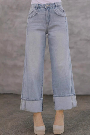 Light wash wide-leg denim jeans with contrast cuffs