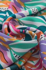 Ruffled collar blouse in multicolor leaf print fabric.