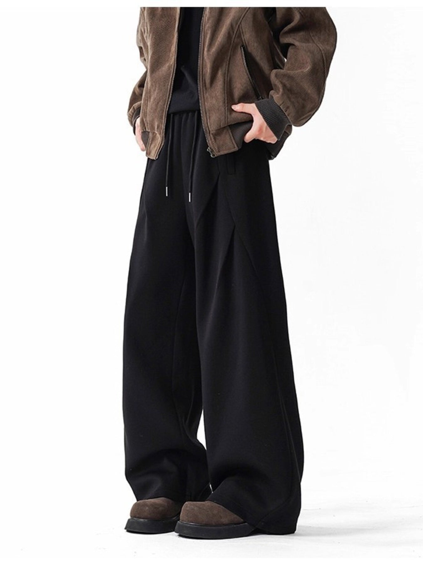 Men's black wide-leg drawstring pants with a relaxed fit