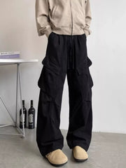 Black relaxed fit cargo pants with drawstring and multi pockets.