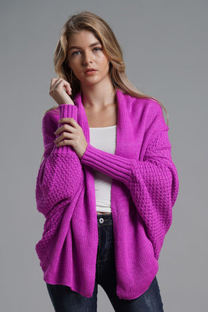 Fuchsia knit batwing cardigan with drape front and textured sleeves.