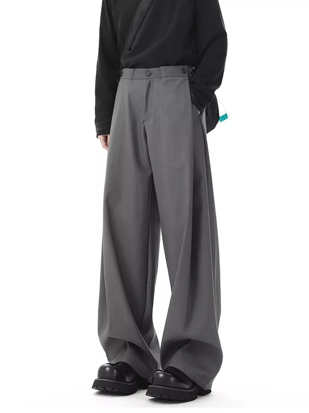 Men's dark gray flowy wide-leg sweatpants with a relaxed fit and button closure.