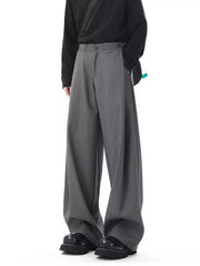 Men's dark gray flowy wide-leg sweatpants with a relaxed fit and button closure.