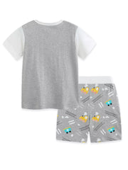 Toddler cotton pajama set with grey t-shirt and grey shorts featuring a whimsical train print.