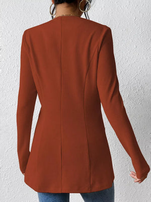 Brown single-button blazer with tailored fit and textured fabric.
