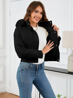 Black puffer jacket with faux fur trim on hood and collar, cropped length.