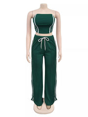 Dark green tube top and wide-leg pant set with white piping and drawstring waist.