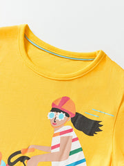 Yellow cotton crew neck t-shirt with a graphic of a girl riding a bicycle.