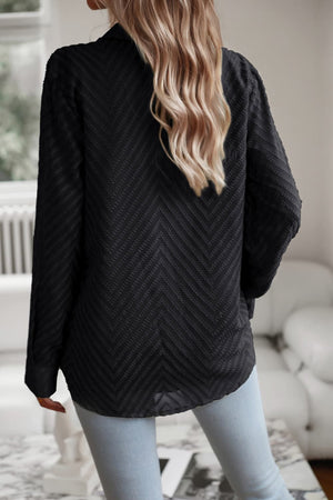Black textured chevron button-down blouse with long sleeves