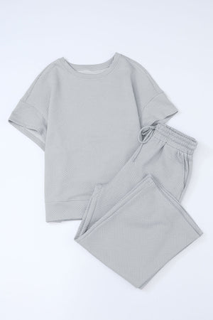 Light gray textured knit tee and wide leg pants set with drawstring waist