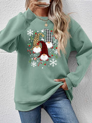 Sage green raglan sweatshirt with festive gnome graphic and snowflakes.