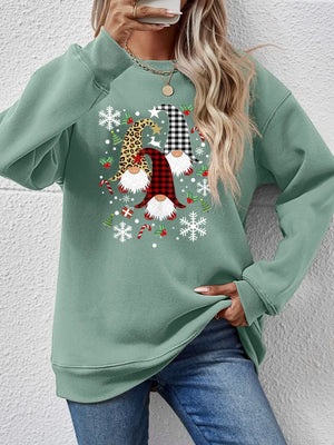 Sage green raglan sweatshirt with festive gnome graphic and snowflakes.